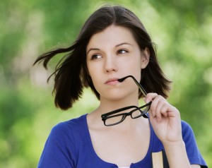 Woman with glasses considering LASIK