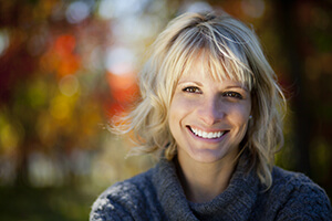 Woman smiling after Plastic Surgery